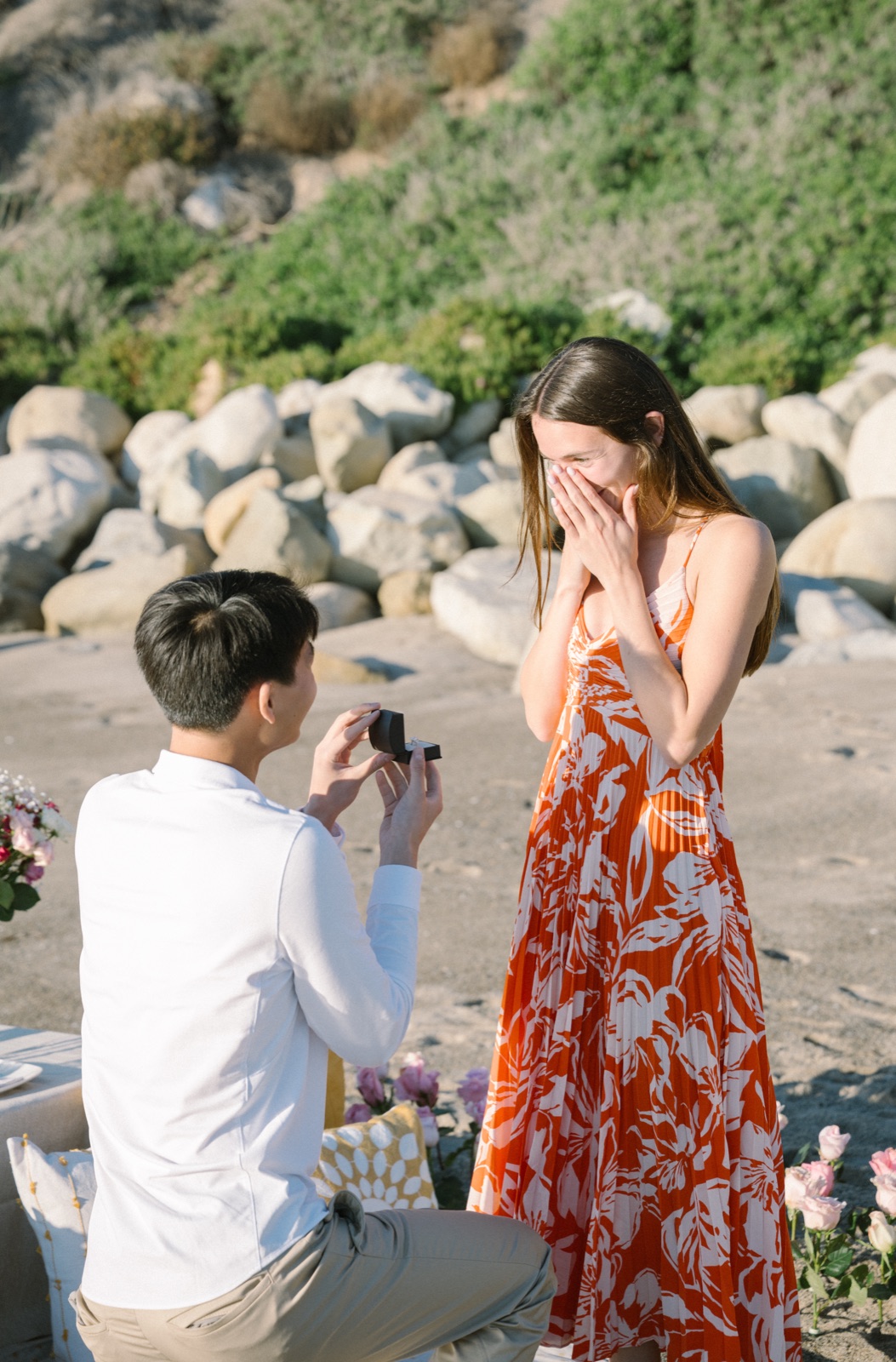 Courtney's hands fly to her face the moment Jonathan opens the ring box